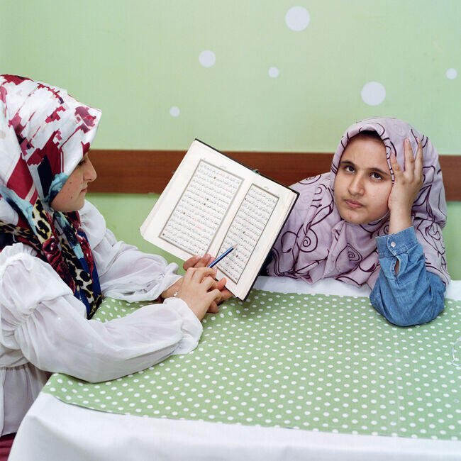 3. Hatice, nine, tries to recite Quran passages by memory to her classmate. Istanbul, Turkey, 2021 © Sabiha Çimen Magnum Photos.jpg
