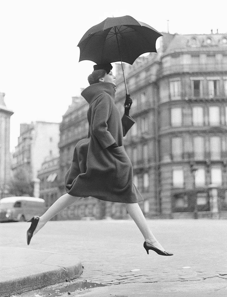 8.Carmen (Homage to Munkacsi) coat by Cardin, Place Francois-Premier, Paris, August 1957.jpg